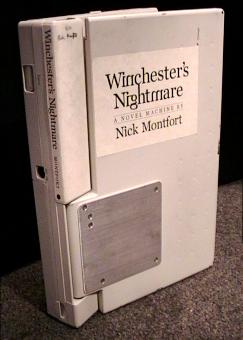 Winchester's Nightmare hardback: parchment cover and spine mounted on a 386 laptop.